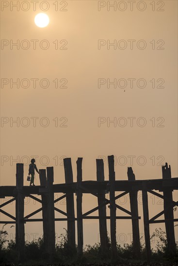 Locals on a teak bridge