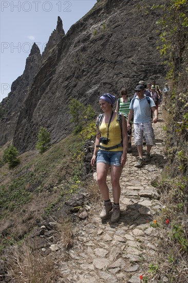 Hikers on a trail on the steep slopes of the Paul Valley