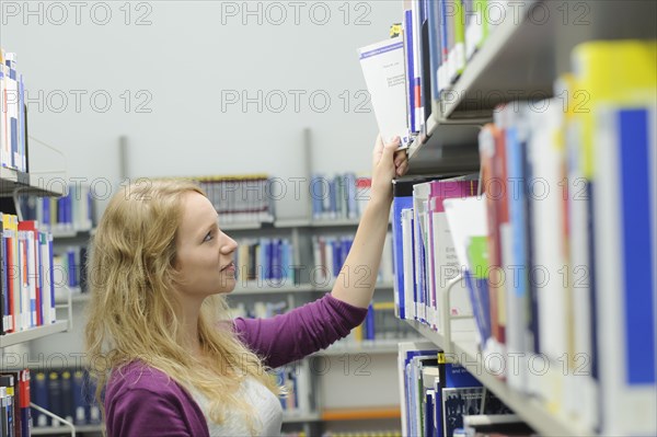 Student studying in the departmental library of the University of Hohenheim in Schloss Hohenheim Palace