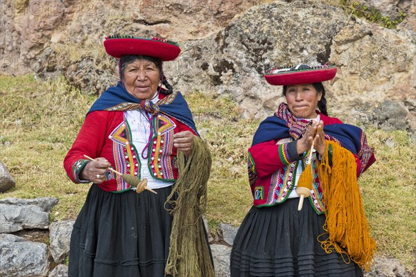 Two elderly women wearing hats