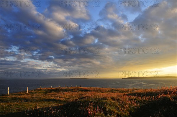 Atmospheric clouds at sunset near Hoxa Head