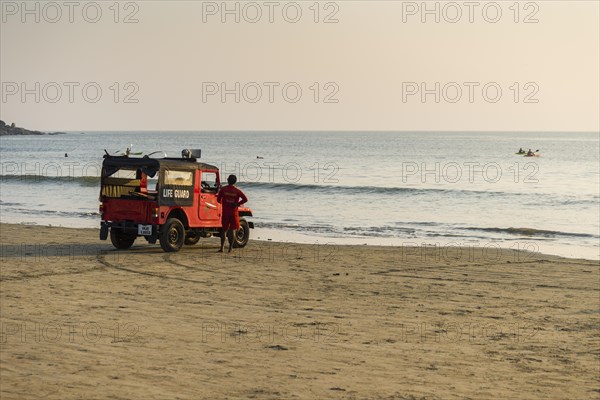 Live guards with a red jeep are watching Palolem Beach