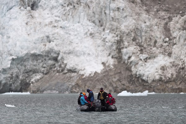 Tourists and guides in an inflatable boat