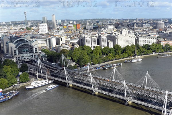 Hungerford Bridge over the River Thames with Charing Cross Station