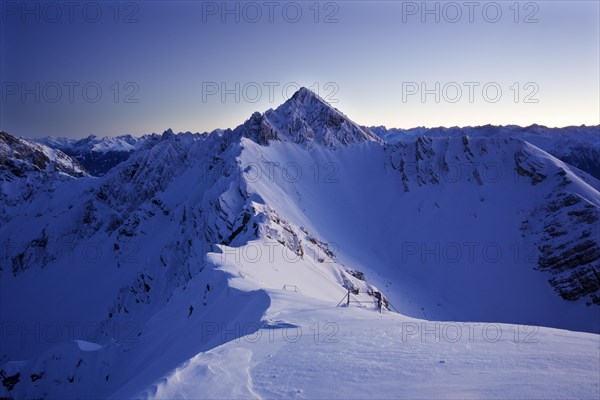 Frozen north face of Reitherspitze Mountain at dusk