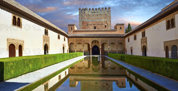 Arabesque Moorish architecture and pond of the Court of the Myrtles of the Palacios Nazaries
