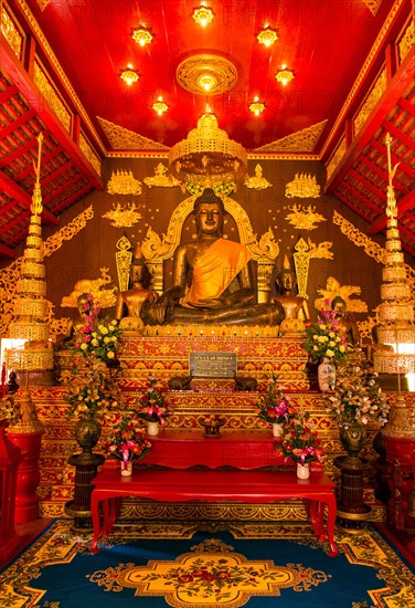 Historical bronze Buddha in the Viharn of Phra Kaeo