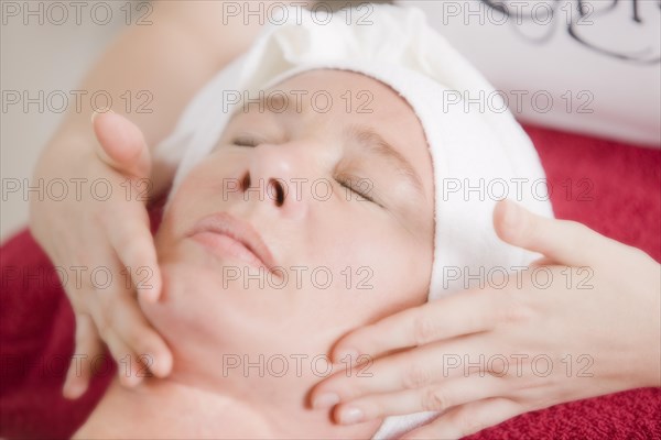 Woman receiving a face massage