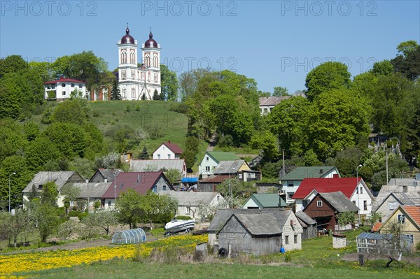 Church of St John the Baptist with the town of Seredzius