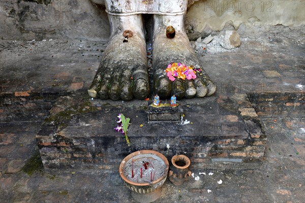 Feet of the standing Buddha statue Phra Attharot