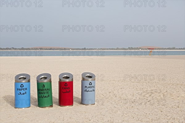 Rubbish bins for sorting waste on the beach at Corniche Road