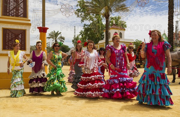 Women wearing gypsy dresses at the Feria del Caballo