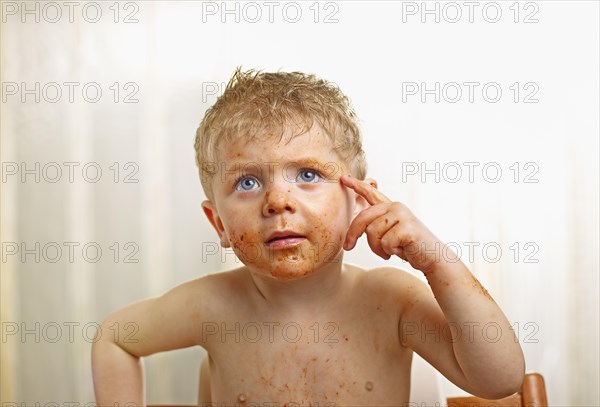 Toddler with a sauce-smeared face