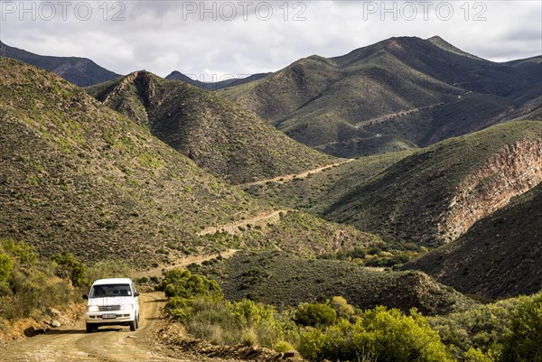 All terrain vehicle travelling on a winding road