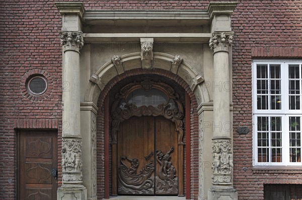 Entrance portal with elaborately carved front door