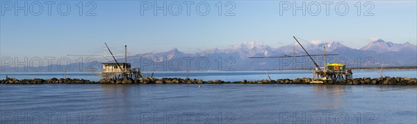 Fisherman's houses with nets over the sea in Marina di Pisa
