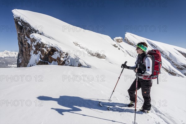 Ski tourer climbing Kleiner Seekofel mountain