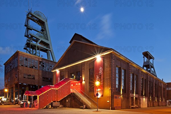 Zeche Ewald colliery with the Revuepalast Ruhr at dusk