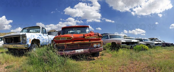 Junk yard with old American cars