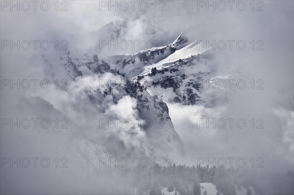 Rocky winter landscape with clouds