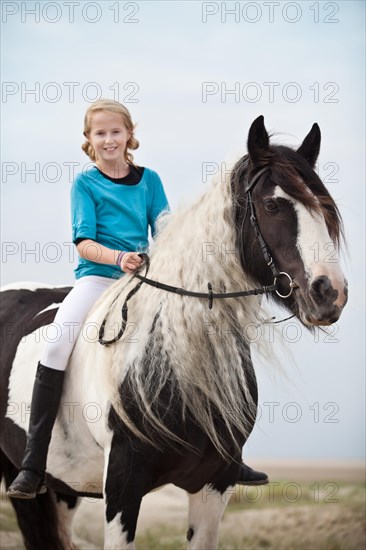 Young horserider riding bareback on a mare