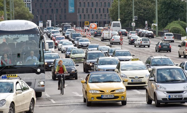 Cyclist and cars in traffic