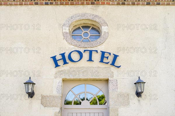 Hotel sign above a door