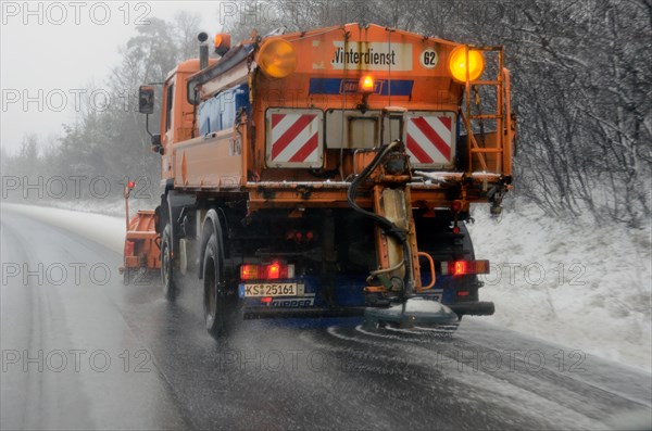 Winter services vehicle spreading salt on a motorway