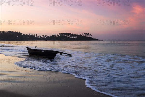 An old fishing boat on Palolem Beach