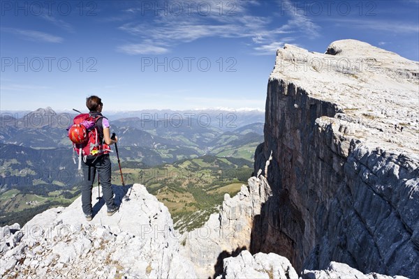 Climber on the Kreuzkofelscharte at the ascend up to Heiligkreuzkofel over the Heiligkreuzkofelsteig via ferrata in the Fanes group in the Fanes-Senes-Prague