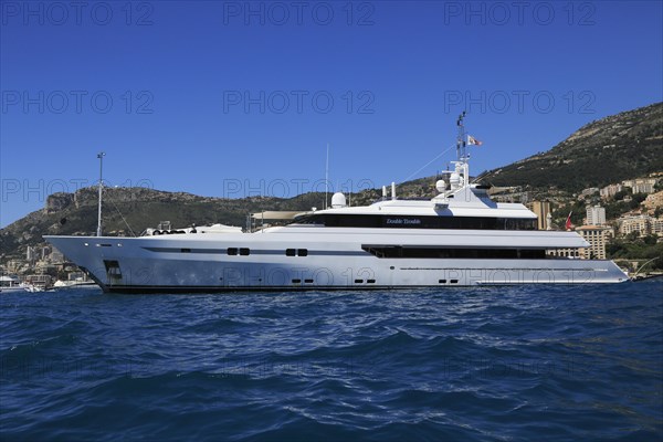 Proteksan Turquoise motor yacht Double Trouble at anchor in front of the Principality of Monaco