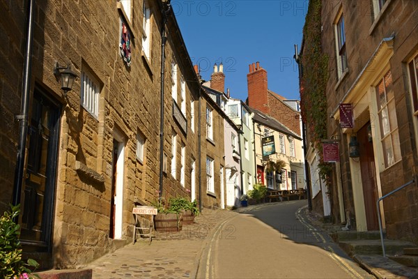 Narrow street of the historic fishing village of Robin Hood's Bay