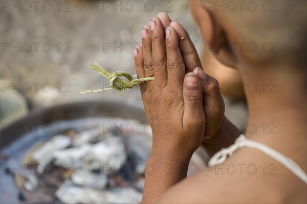 A man is praying during Dashkriya or Asthi Visarjan