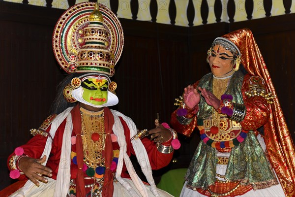 Fully made-up and costumed Kathakali dancers during a performance