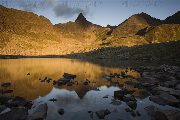 Mountain range reflected in a small lake