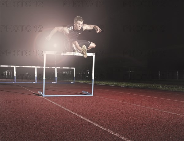 Hurdle racing athlete