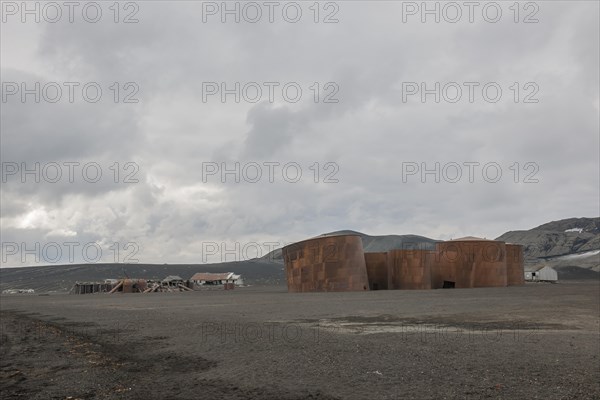 Dilapidated research station and old tanks for holding whale oil