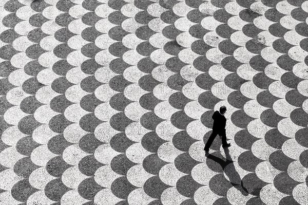 Person seen from above crossing Praca do Municipio square