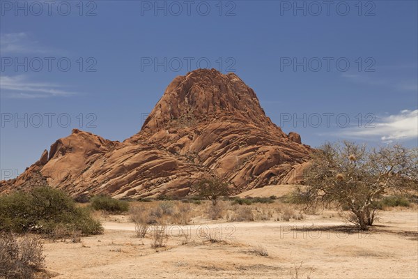 Landscape with rocks around the monadnock of Spitzkoppe Mountain