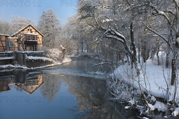 Old mill on the Ilm River in winter