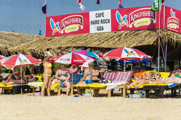 Tourists on the beach in front of Cafe Hard Rock Goa