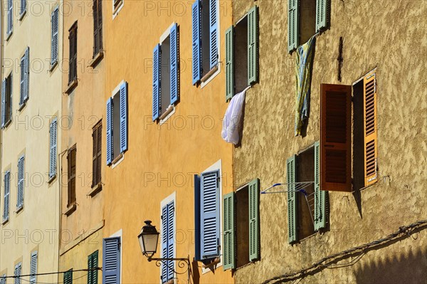 Row of houses with colourful shutters