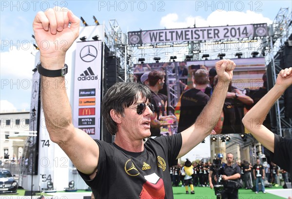 Joachim Low celebrates with fans