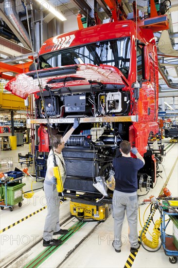 Employees assembling the chassis