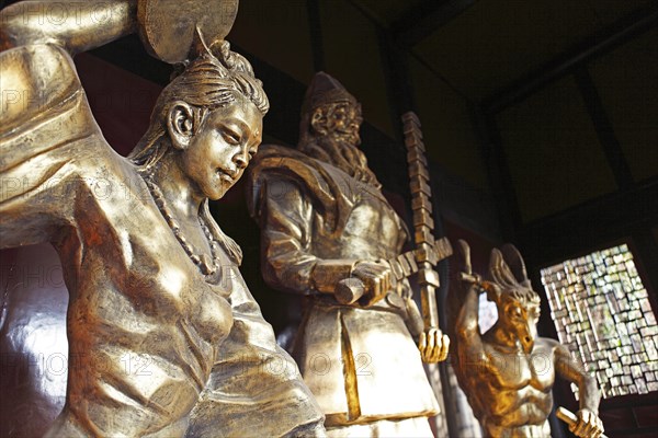 Bronze warrior statues in the Qinglong Caves