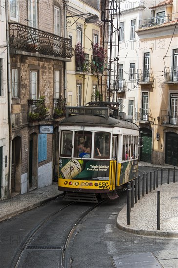 The famous tram 28 travelling in the old quarter