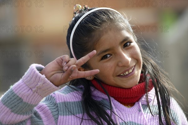 Girl making the victory sign