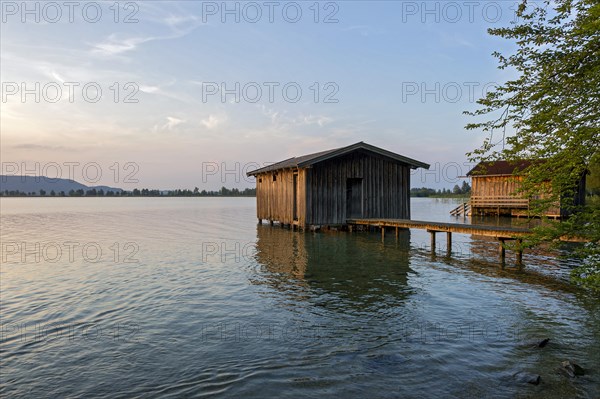 Boathouses on Lake Kochel in the evening light