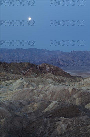 Full moon over the Panamint Range and the Death Valley at dawn