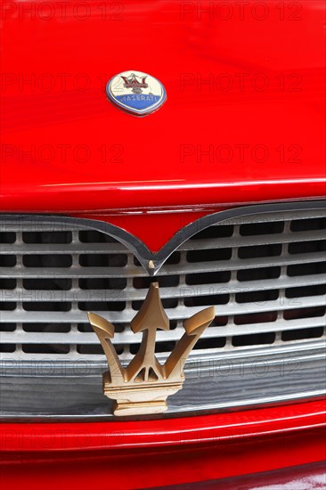 Maserati logo and emblem of trident on a car